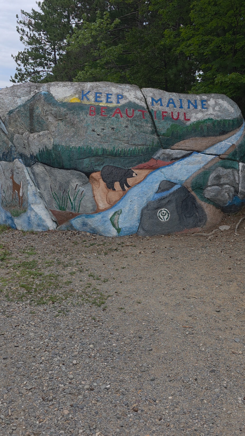 Painted Keep Maine Beautiful stone at a woodland site